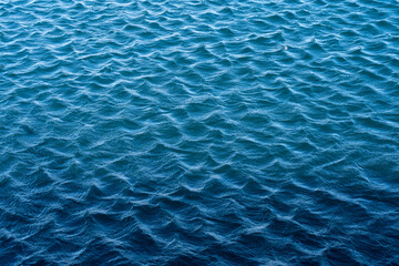 Blue sea surface with waves and ripples