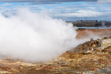 Gunnuhver hot springs at Reykjanes peninsula, Iceland. Popular tourist destination, geothermal power plant in background
