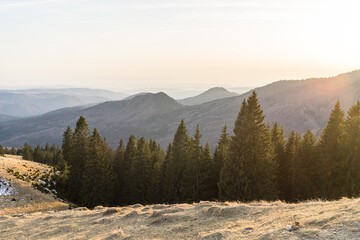 Beautiful landscape of snowy mountains. Beautiful winter nature landscape amazing mountain view. mountain range and pine tree forest with thin snow.