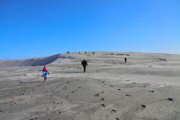 Closeup shot of people climbing the mountain in summer