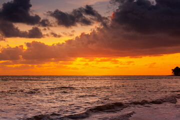 Naklejka na ściany i meble Beautiful red sunrise at sea. Dawn on the Atlantic ocean. The su