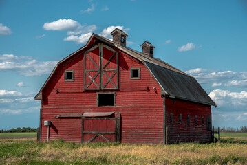 old red barn in the field