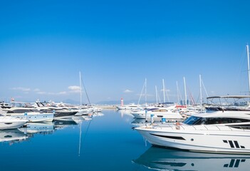 Fototapeta premium Boats parked in the blue sea under a clear sky