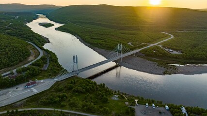 Sami Bridge and Teno river, summer, golden hour in Utsjoki