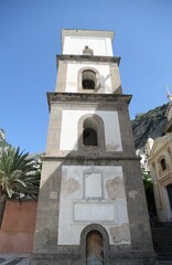 Fototapeta na wymiar Vertical shot of a bell tower of the church of Santa Maria Assunta in Positano, Amalfi Coast, Italy
