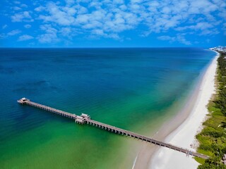 Drone view of a pier on the beach of Naples in Florida, Gulf of Mexico