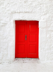 Door red color with mortise lock in house with white walls, Turkish building, national colors...