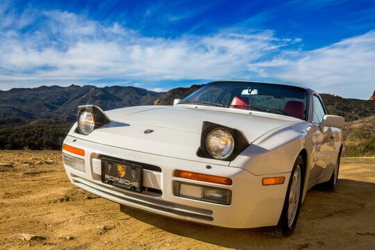 Vintage Porsche 944 turbo car with open head lights