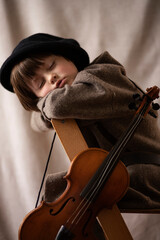 Sleeping boy with violin