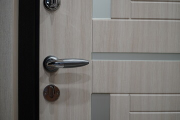 Exterior door handle and Security lock on Metal frame. Door handle with lock in the door
