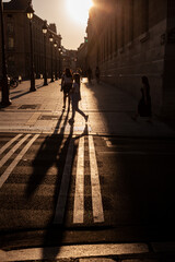 Paris Street Scene of unrecognizable people walking at sunset
