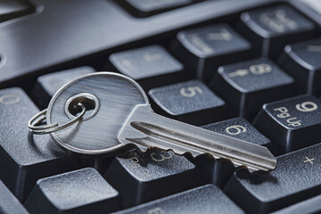 Protecting personal data and money , key on computer keyboard.