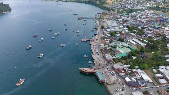 Aerial of the buildings and streets of Dalcahue city in Chiloe Island, Chile on the shore of the sea