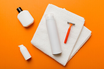 shaving man set. shaving machine, towel, lotion and shaving foam on colored background. Men bath Accessories top view