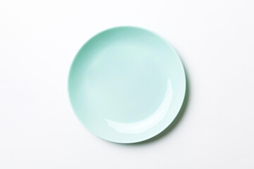 Top view of isolated of colored background empty round blue plate for food. Empty dish with space for your design