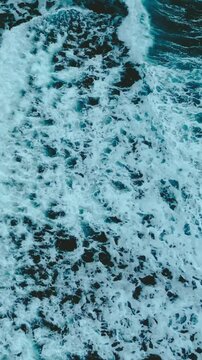 Aerial view of big waves in the blue ocean