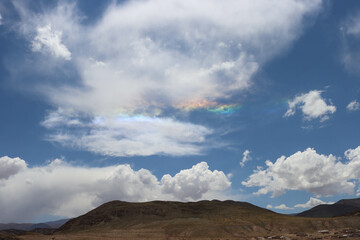 Fototapeta na wymiar Reflection of light in the clouds forms a rainbow