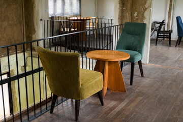 Colorful Chairs and table in modern room.