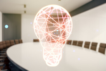 Abstract virtual light bulb hologram on a modern boardroom background, idea concept. Multiexposure