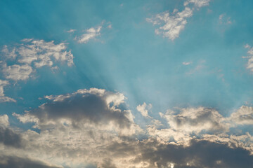 sun rays with blue cloudy sky