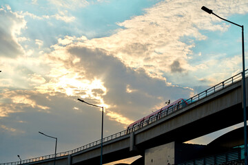 Metro train entering in to the station during sunset under the beautiful clouds at cairo international airport, CIA, Egypt - obrazy, fototapety, plakaty