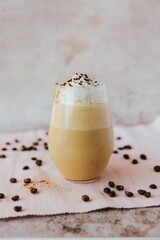 Vertical shot of a glass with a cool trendy mocha with chocolate chips