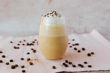 Glass with a cool trendy mocha with chocolate chips