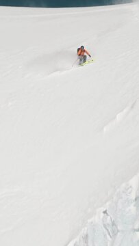 Person skiing in the snowy mountains
