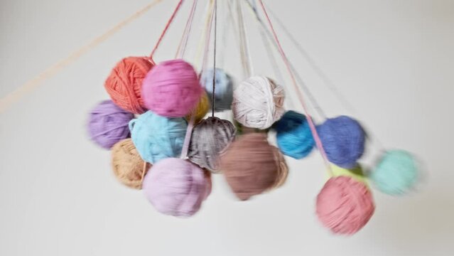 Spining colorful woolen yarn balls close-up