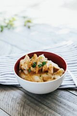 Closeup shot of Grilled Chicken and Mash Potatoes in a small bowl