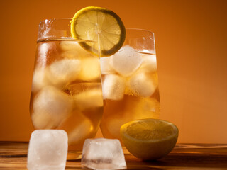 Iced tea in a glass with ice cubes. Cold tea with ice.