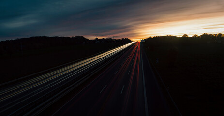 Night autobahn, amazing long exposure. Web banner, free space.
