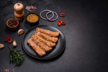 Tasty meat brawn or roll on a wooden cutting board with spices and herbs