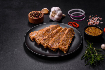 Tasty meat brawn or roll on a wooden cutting board with spices and herbs