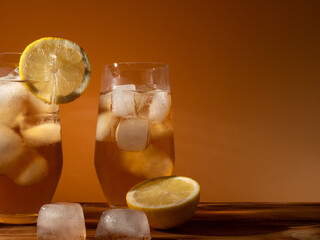 Iced tea in a glass with ice cubes. Cold tea with ice.