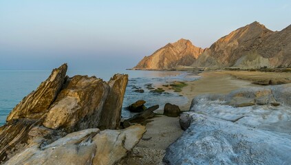 Beautiful seascape of a rocky beach at sunset
