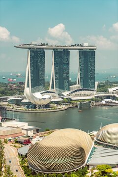 Vertical shot of Marina Bay Sands hotel and the bay in Singapoe in blue sky background