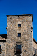Fototapeta na wymiar Medieval palace tower in the old town of Avila. View against blue sky