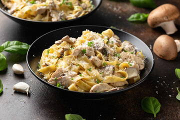 Creamy Alfredo pasta with chicken, mushrooms and parmesan cheese. Healthy Italian food