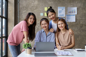 Group of young Asian business woman are meeting to present a new roadmap in product design with laptop computers in the office.