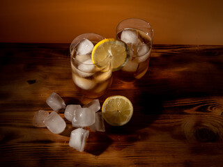 Iced tea in a glass with ice cubes. Cold tea with ice.