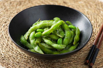 Edamame beans in a ceramic bowl, soybeans, selective focus