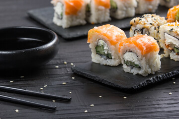 Philadelphia roll sushi with salmon, prawn, avocado, cream cheese. Sushi menu. Japanese food.