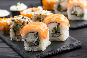 Philadelphia roll sushi with salmon, prawn, avocado, cream cheese. Sushi menu. Japanese food.