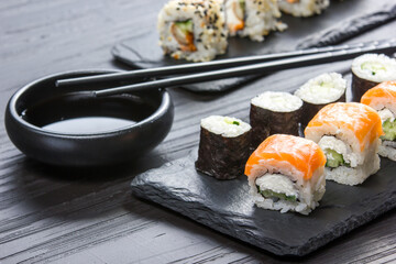 Philadelphia roll sushi with salmon, prawn, avocado, cream cheese. Sushi menu. Japanese food.