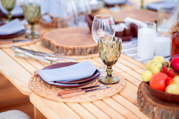 Eco-friendly Table setting with natural wooden objects. Sawing wood is used in everyday life to set...