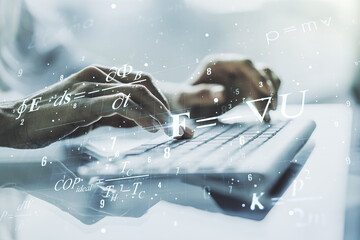 Creative scientific formula hologram with hands typing on computer keyboard on background, research...