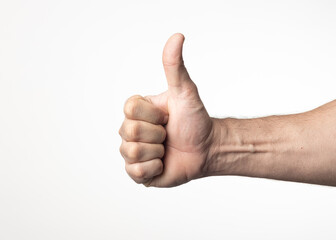 A man's hand and arm on a nuclear white background, showing a gesture of greeting approval or positivity.