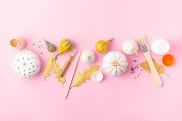 Autumn concept craft for kids, felt pumpkins with eyes and decorated pumpkins white and gold leaves