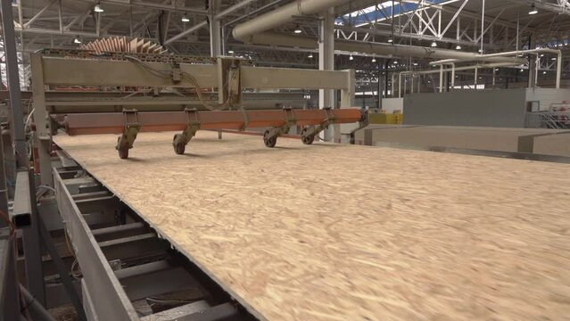 modern woodworking plant. production of OSB boards. the concept of production, manufacturing and woodworking industry - chipboard processing